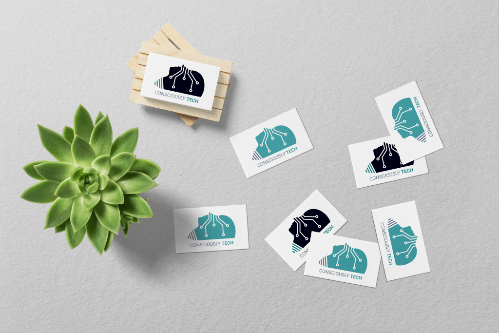 Scattered business cards with the Consciously Tech logo