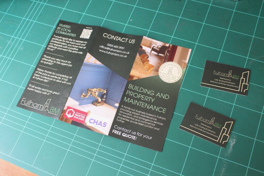 Fulham BM tri-fold brochure open at the contact panel, shown with business cards and the CHAS accreditation badge